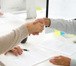 handshake man woman after signing business contract closeup