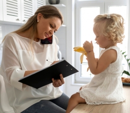 mom working home with child during quarantine