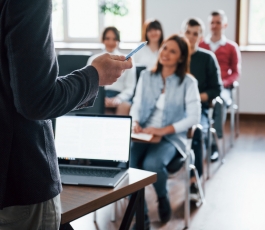 everyone is smiling listens group people business conference modern classroom daytime