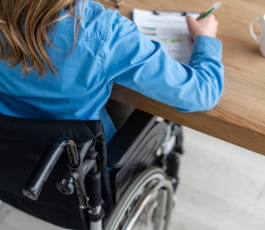 close up woman wheelchair working office