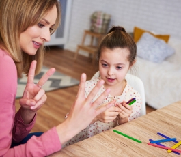 young mum teaching child count home