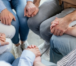 close up people holding hands